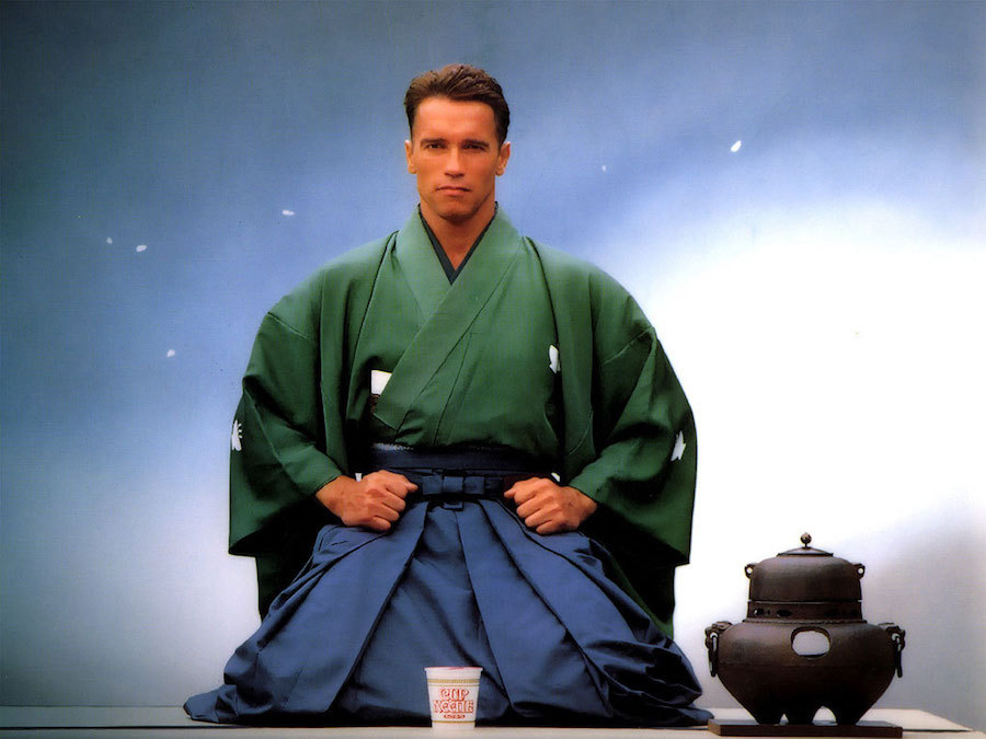 Image: Arnold Schwarzenegger, dressed and posed immaculately in yukata, from an old cup noodle advert.